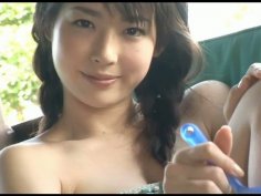 Adorable Japanese adult model Nanako Sawa poses on a cam outdoors