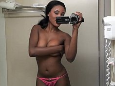 Black amateur babe posing on camera